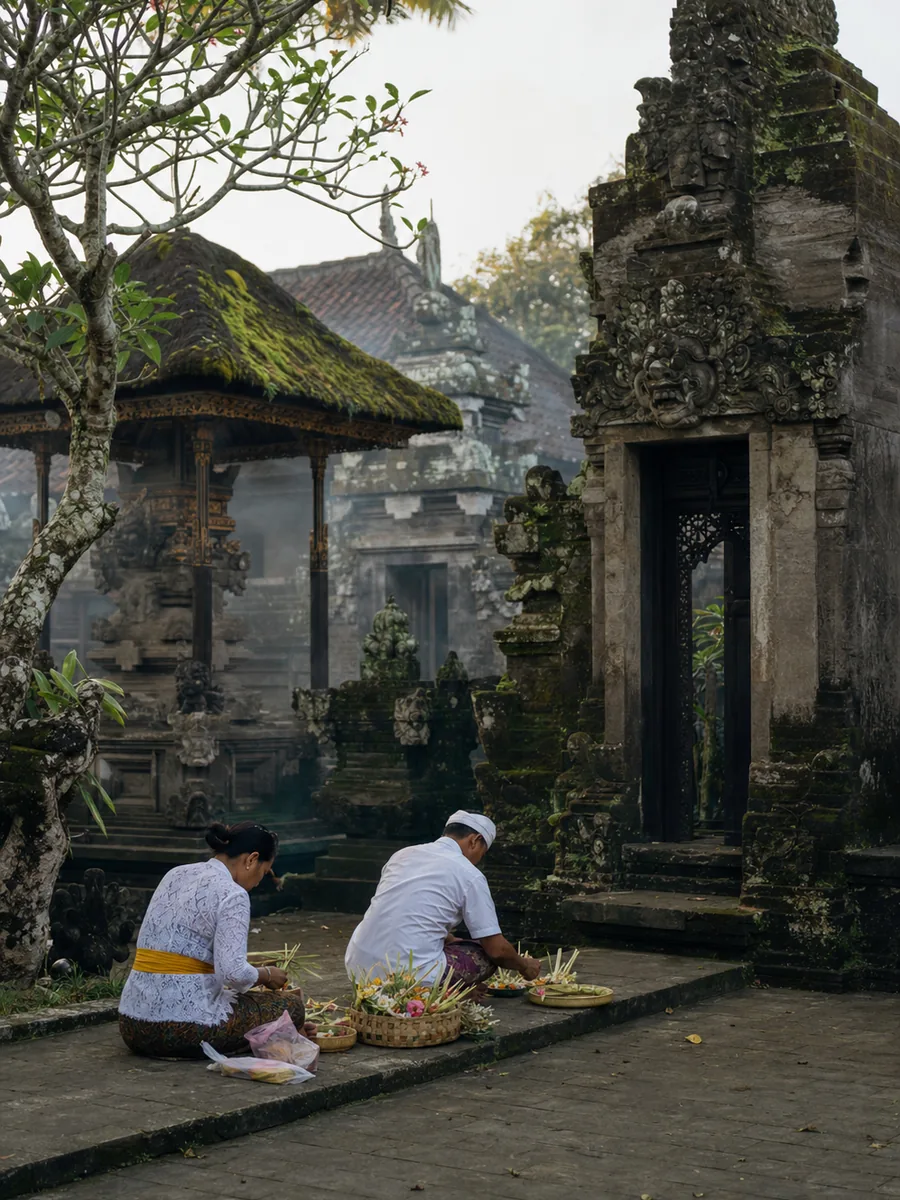 Editorial scene of morning preparations in a Balinese temple courtyard